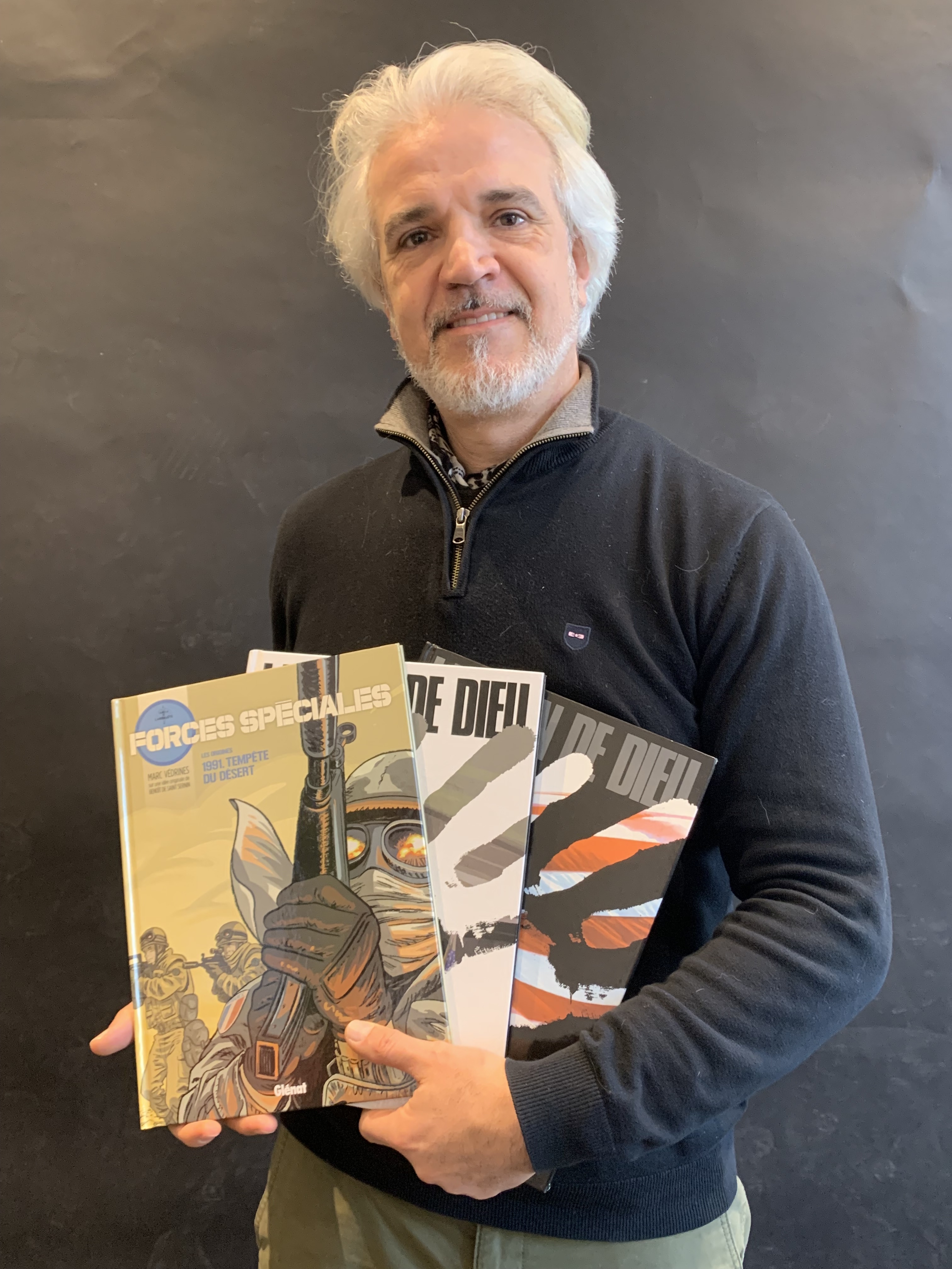 Marc Védrines et trois de ses bandes déssinées, publiées aux éditions Glénat
